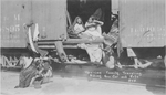 Mexican family traveling in a box car